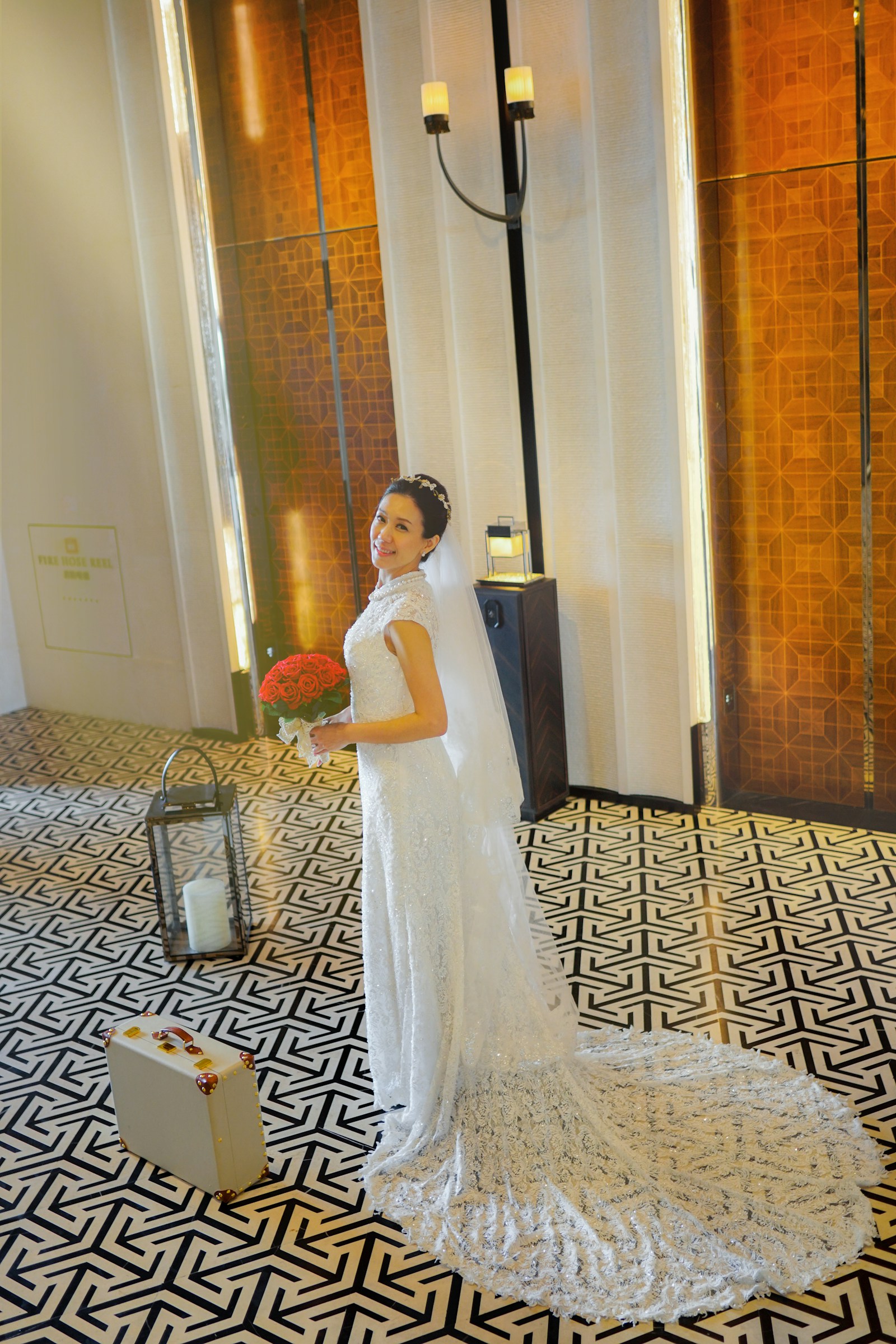 Bride with red roses in an Art Deco interior with geometric flooring