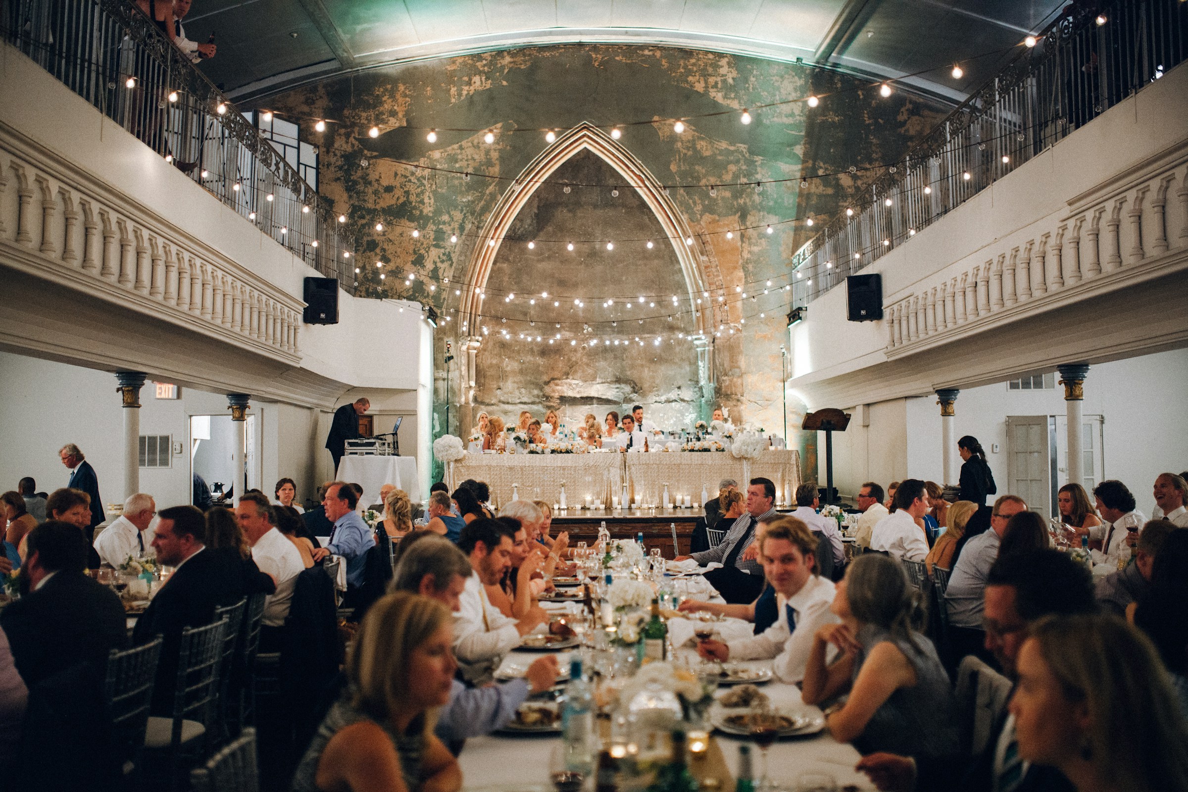Wedding guests sharing dinner together at the reception