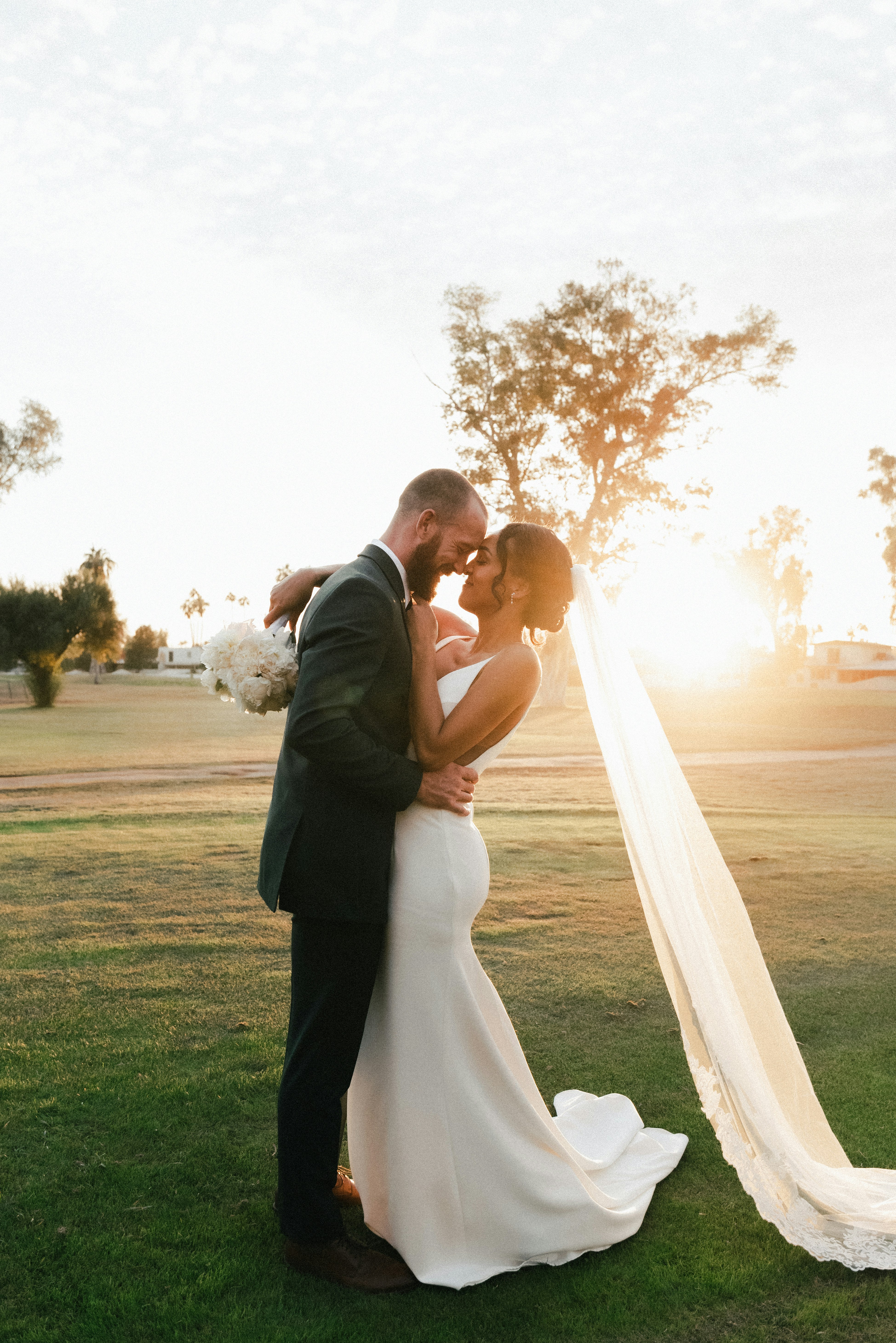 Late afternoon light through a tall curtained window in the room where Hana and Elliot married