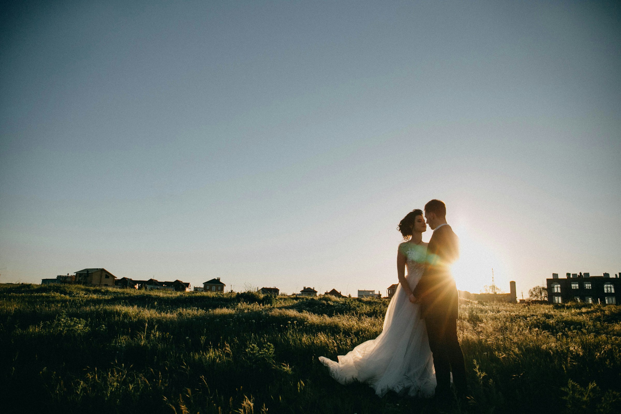 Newlyweds sharing a quiet moment outdoors